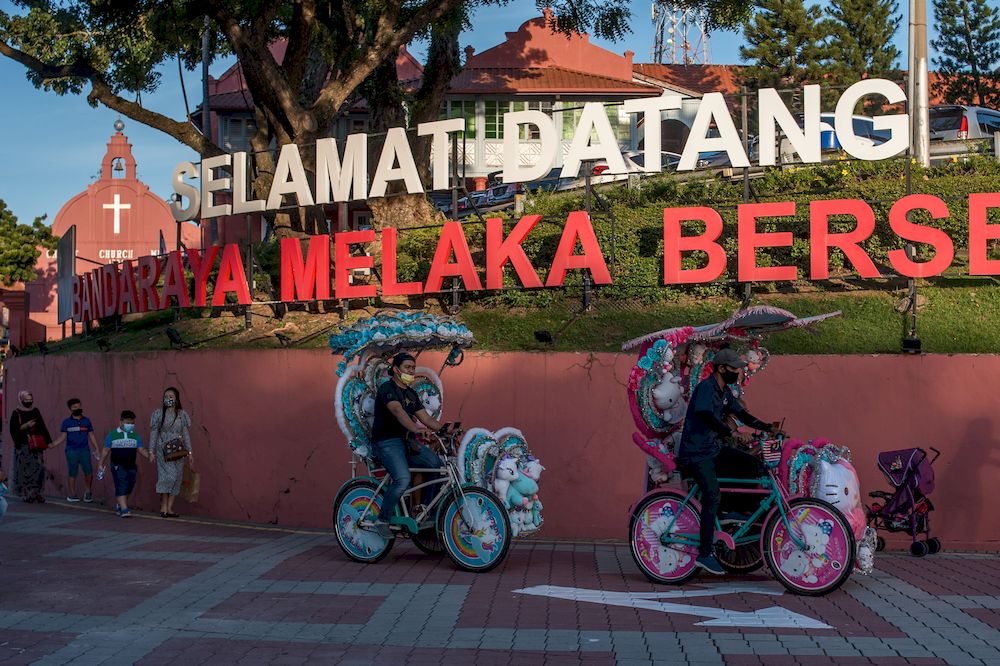 People are seen enjoying riding in trishaws at the Stadthuys, a historical structure situated in the heart of Melaka City, November 6, 2021. u00e2u20acu201d Picture by Shafwan Zaidon