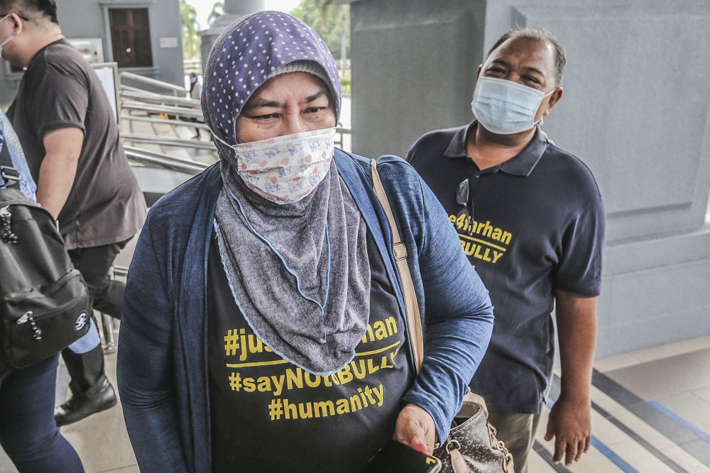 Parents of marine cadet officer Zulfarhan Osman Zulkarnain arrive at the Kuala Lumpur High Court November 2, 2021. u00e2u20acu201d Picture by Hari Anggara