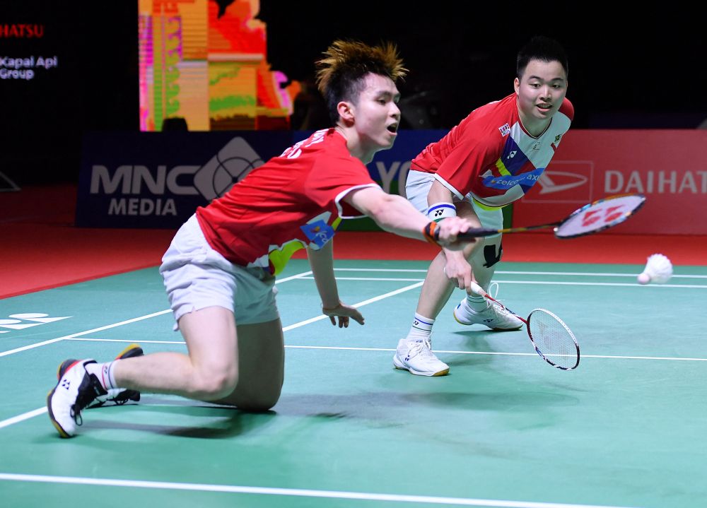 Malaysiau00e2u20acu2122s Aaron Chia (right) and Soh Wooi Yik competing against Japanu00e2u20acu2122s Takuro Hoki and Yugo Kobayashi during their men's doubles semi-final badminton match at the Indonesia Masters in Nusa Dua November 20, 2021.u00e2u20acu2022 AFP pic