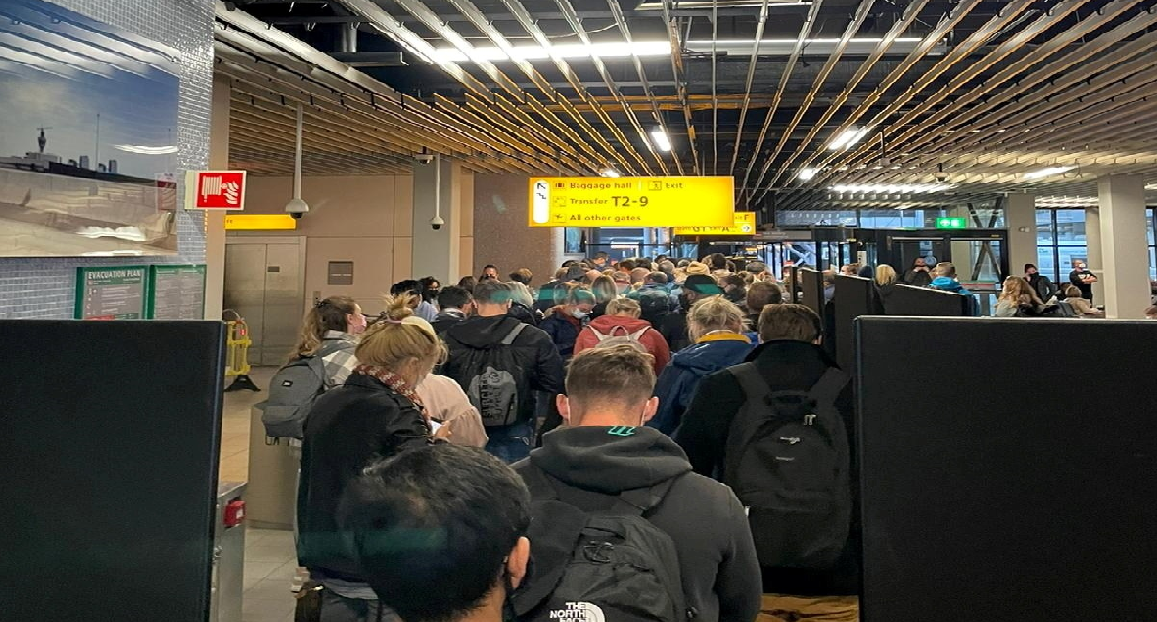 Passengers travelling from South Africa queue to be tested after being held on the tarmac at Schiphol Airport, Netherlands November 26, 2021, in this picture obtained from social media. u00e2u20acu2022 Handout via Reuters