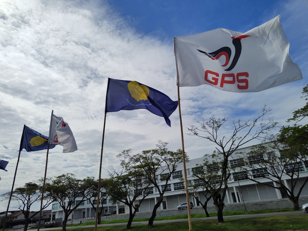 PDP and GPS flags are seen at the PDP Dudong office. u00e2u20acu201d Borneo Post Online pic