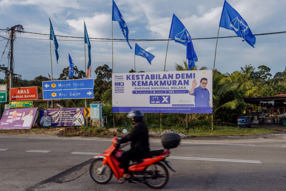 nBillboards and banners featuring Barisan Nasional candidate Sulaiman Md Ali are seen in Lendu, Melaka November 15, 2021. u00e2u20acu201d Picture by Shafwan Zaidonn