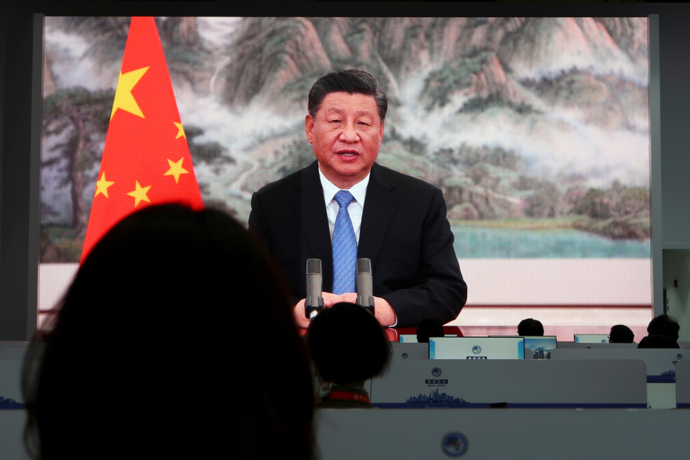Chinese President Xi Jinping is seen on a giant screen at a media centre as he delivers a speech via video at the opening ceremony of the China International Import Expo (CIIE) in Shanghai, China November 4, 2021. u00e2u20acu201d Reuters picn