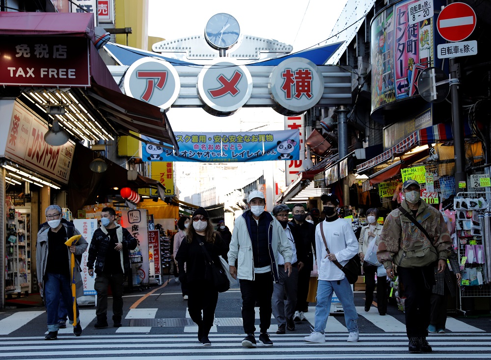 Pedestrians wearing protective masks, amid the coronavirus disease outbreak, make their way at the Ameyoko shopping district in Tokyo December 1, 2021. u00e2u20acu201d Reuters pic