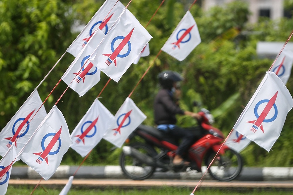 DAP flags are seen along a road ahead of the Sarawak State polls,  in Kuching December 15, 2021. u00e2u20acu201d Picture by Yusof Mat Isa