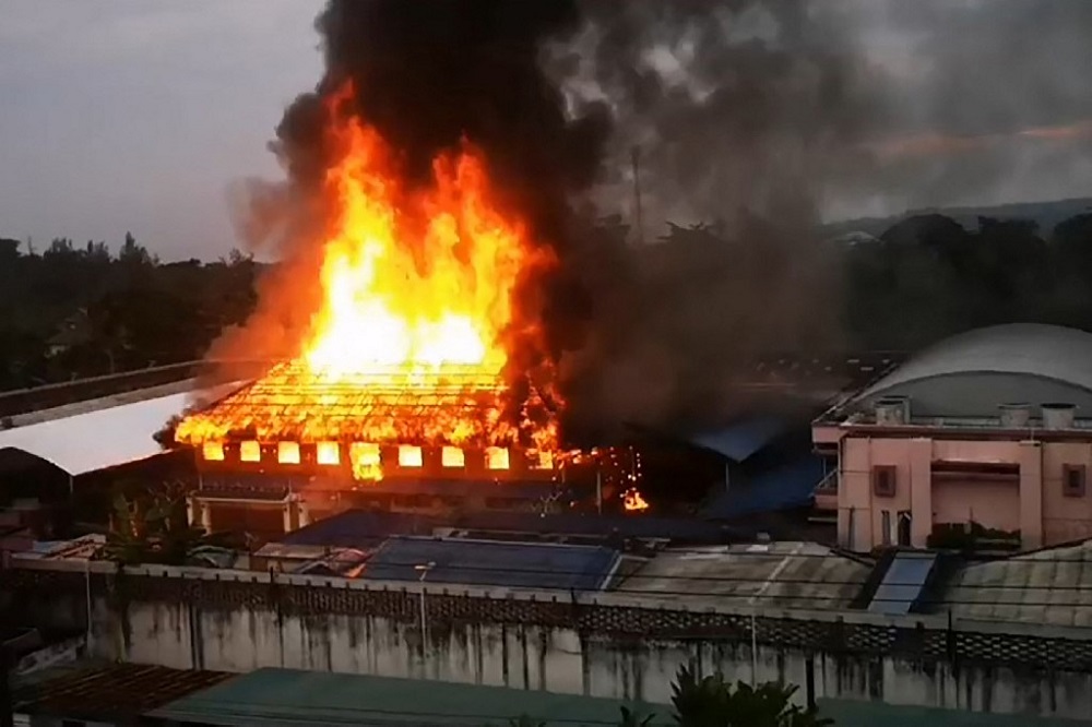 This frame grab from video footage shows a fire set by prisoners during a two-day riot over the handling of a Covid-19 coronavirus cluster, at a prison in Krabi. Video taken on December 17, 2021. u00e2u20acu201d Picture courtesy of Thapakorn Srithong via AFPTV