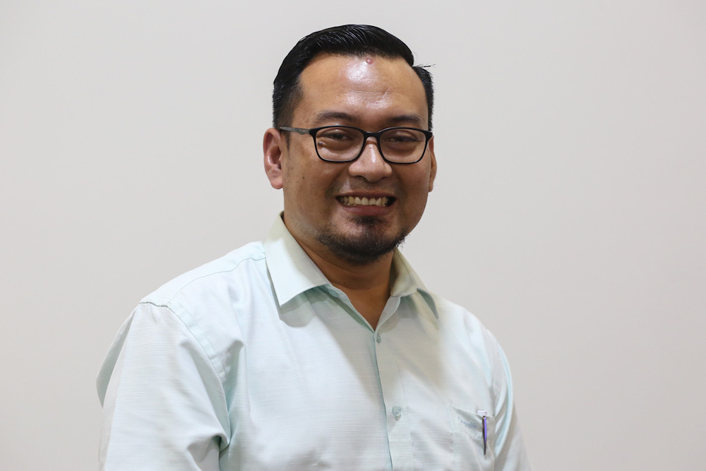 PAS candidate for Dun Beting Maro Mohammad Arifirizul Paijo poses for a picture at the Waterfront Hotel in Kuching December 4, 2021. u00e2u20acu201d Picture by Yusof Mat Isann