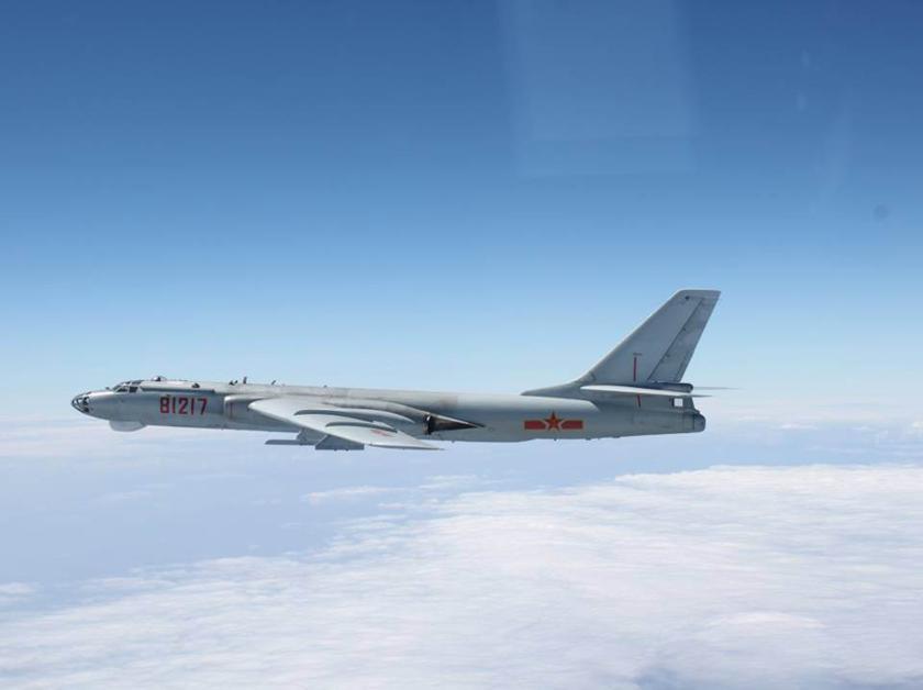 A Chinese military plane H-6 bomber flies through airspace between Okinawa prefecture's main island and the smaller Miyako island in southern Japan, out over the Pacific, in this handout photo taken October 27, 2013 by Japan Air Self-Defence Force and rel