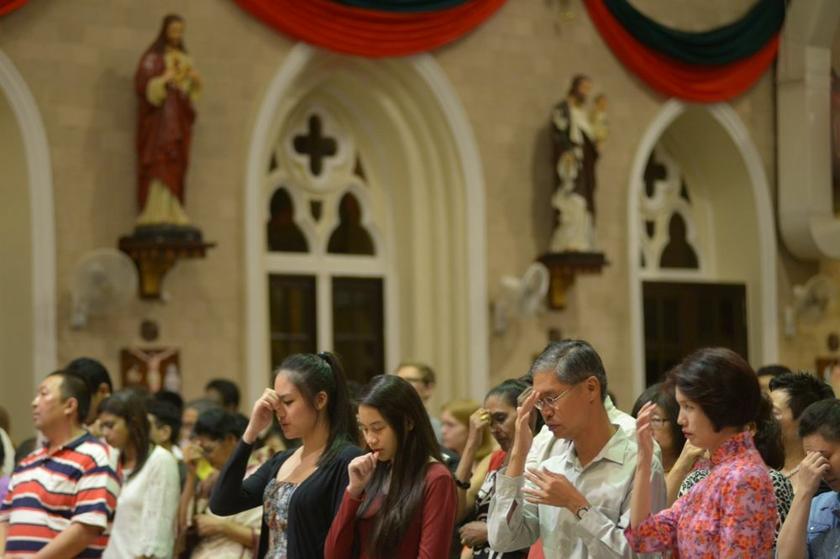 Christian attending the Christmas eve midnight mass at the Church of the Immaculate Conception in Penang for blessing, December 25, 2013. u00e2u20acu201d Picture by K.E. Ooi