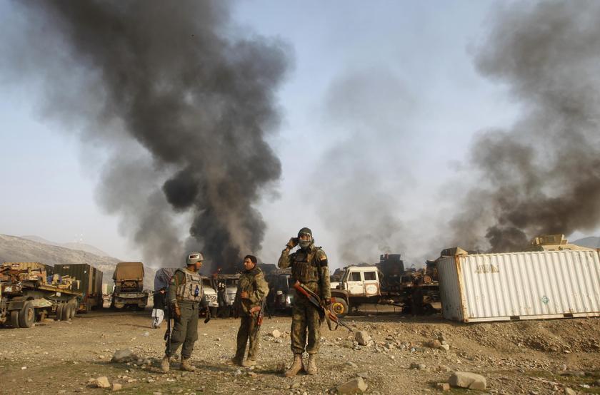 Afghan security forces stand near burning NATO supply trucks after what police officials say was an attack by militants in the Torkham area near the Pakistani-Afghan border in Jalalabad Province December 18, 2013. u00e2u20acu201d Reuters pic