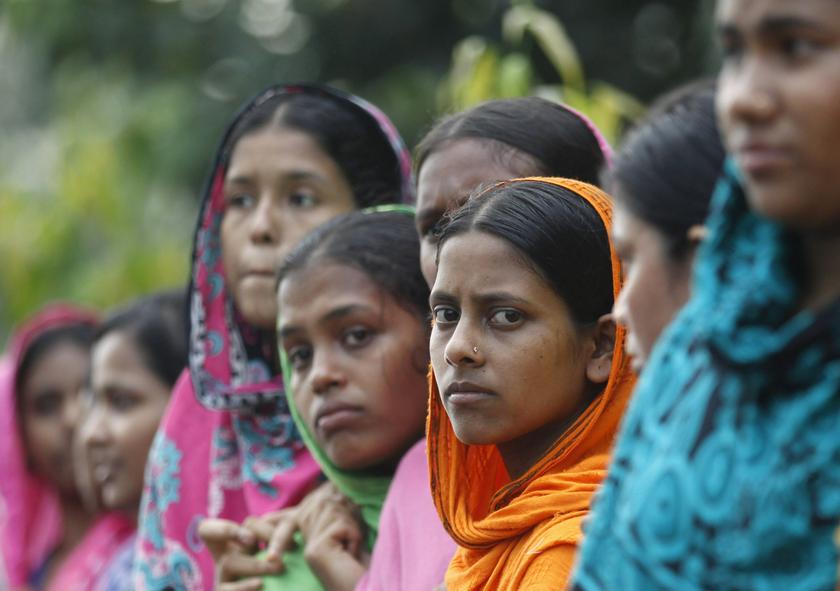 Garment workers gather in front of the head office of Bangladesh Garment Manufactures & Exporters Association (BGMEA), during a protest in Dhaka September 23, 2013. u00e2u20acu201d Reuters pic
