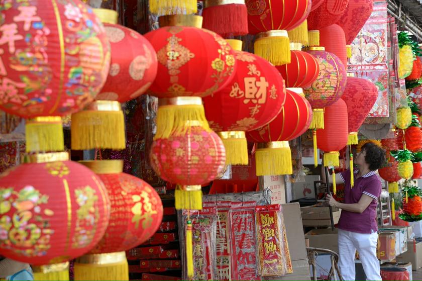 A shop assistant reaching for a Chinese New Year decorative lantern on sale in George Town, Penang, on January 24, 2014. u00e2u20acu201d Picture by K.E. Ooi