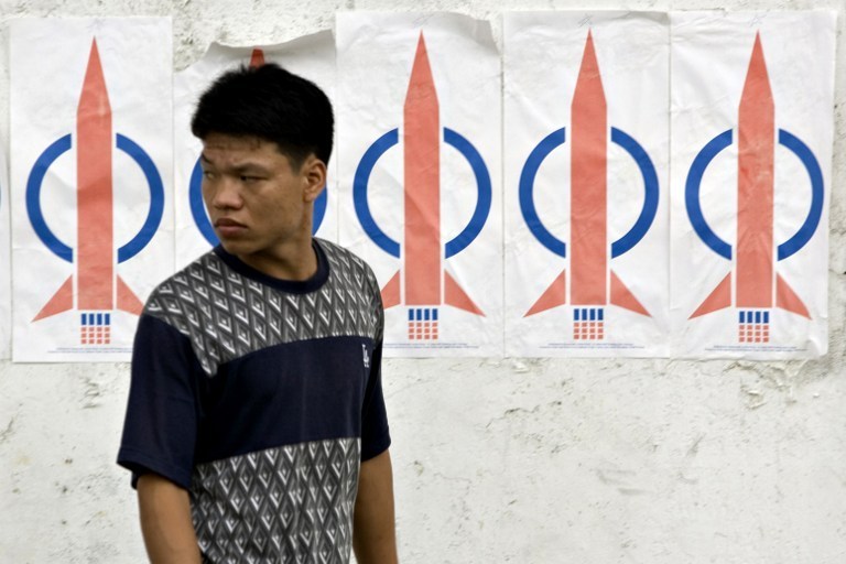 A man walks past DAP banners in Penang on the eve of Malaysiau00e2u20acu2122s 12th general election on March 7, 2008. u00e2u20acu201d AFP pic