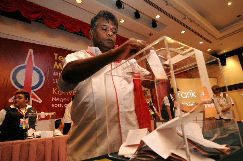 A DAP delegate dropping his ballot paper into the ballot box during the Penang DAP Convention 2013 in George Town December 1, 2013. u00e2u20acu201d Picture by K.E. Ooi