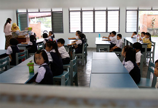 A group of pupils in their classroom at one of Malaysiau00e2u20acu2122s many vernacular schools.