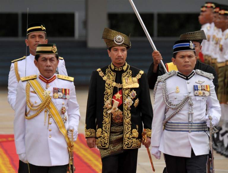 Tuanku Mizan Zainal Abidin inspects the royal guard of honour during a farewell ceremony at Parliament House in Kuala Lumpur on December, 12 2011. He was 13th Yang di-Pertuan Agong, stepping down from his post after a five-year reign. u00e2u20acu201d AFP pic